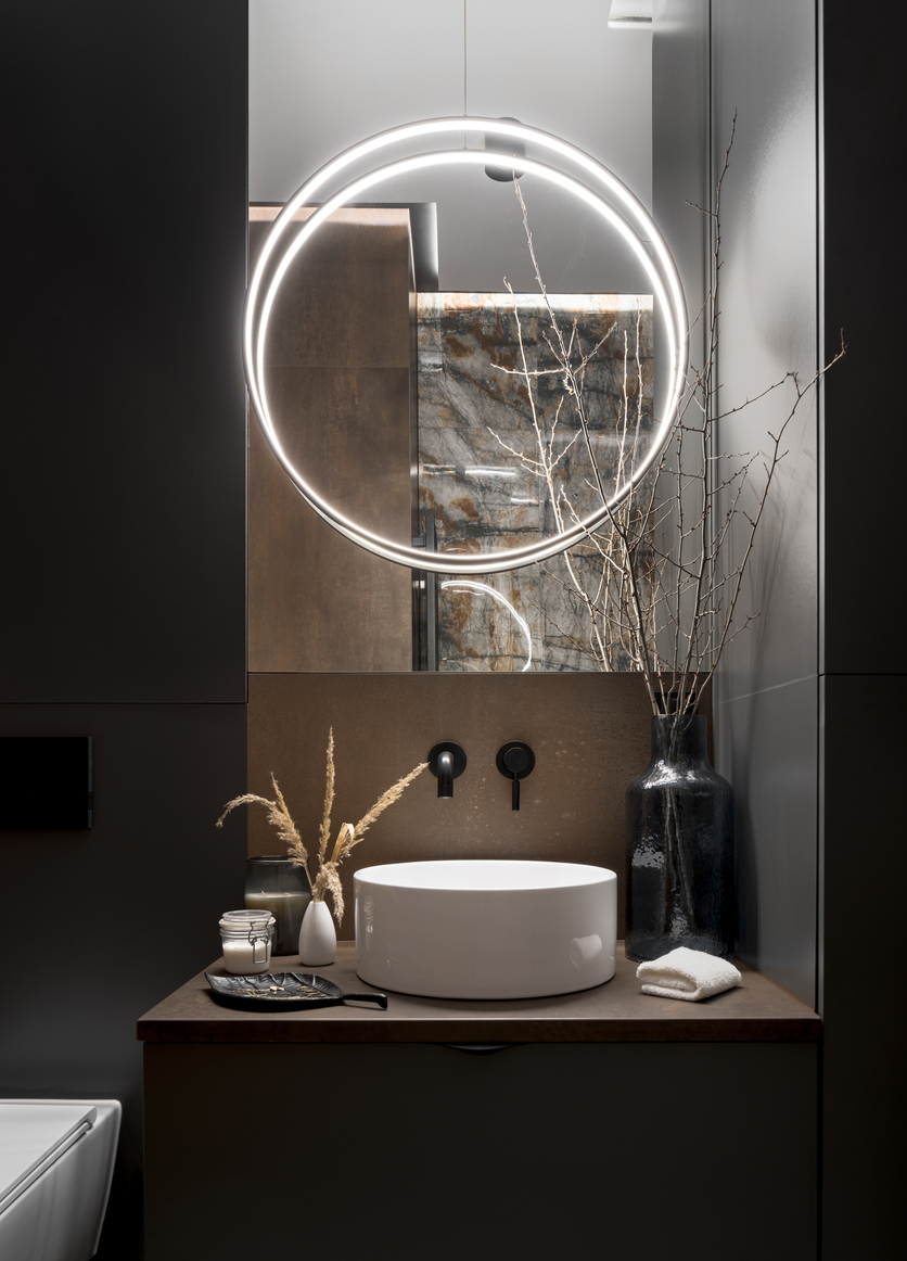 Elegant, round led lamp in modern bathroom